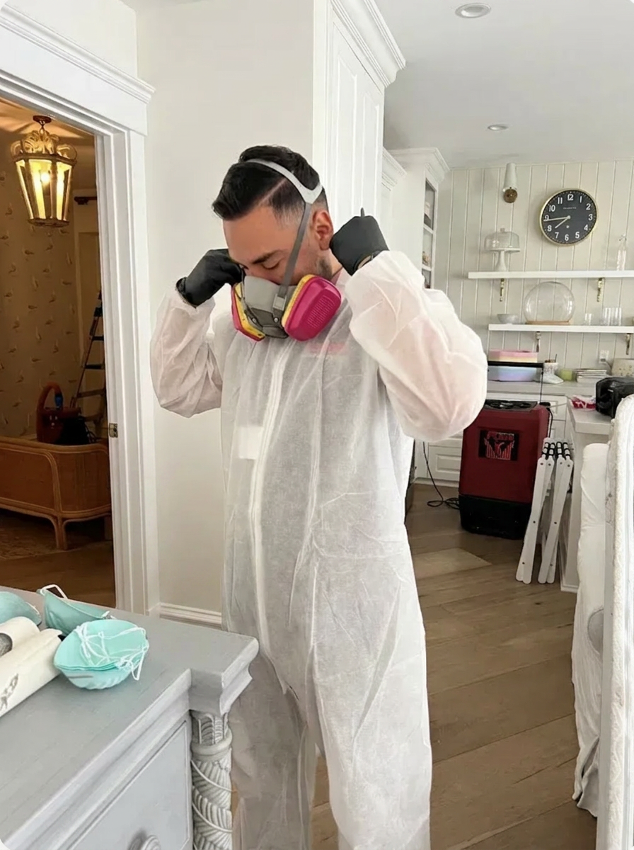 Stink Stompers technician suited up for a Denver odor remediation job.